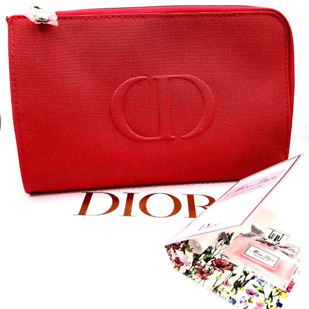 Dior miss dior parfum sample and a red cosmetic bag